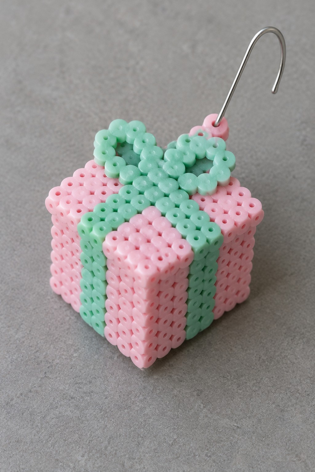 Pink and mint green perler bead gift box ornament with metal hook