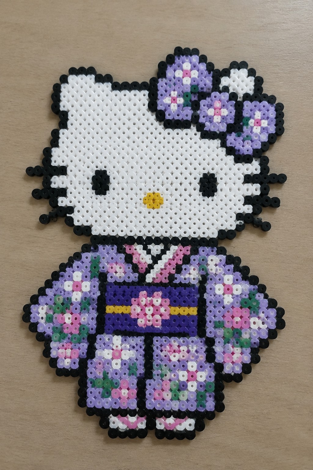 Perler bead Hello Kitty in colorful patterned kimono with floral bow