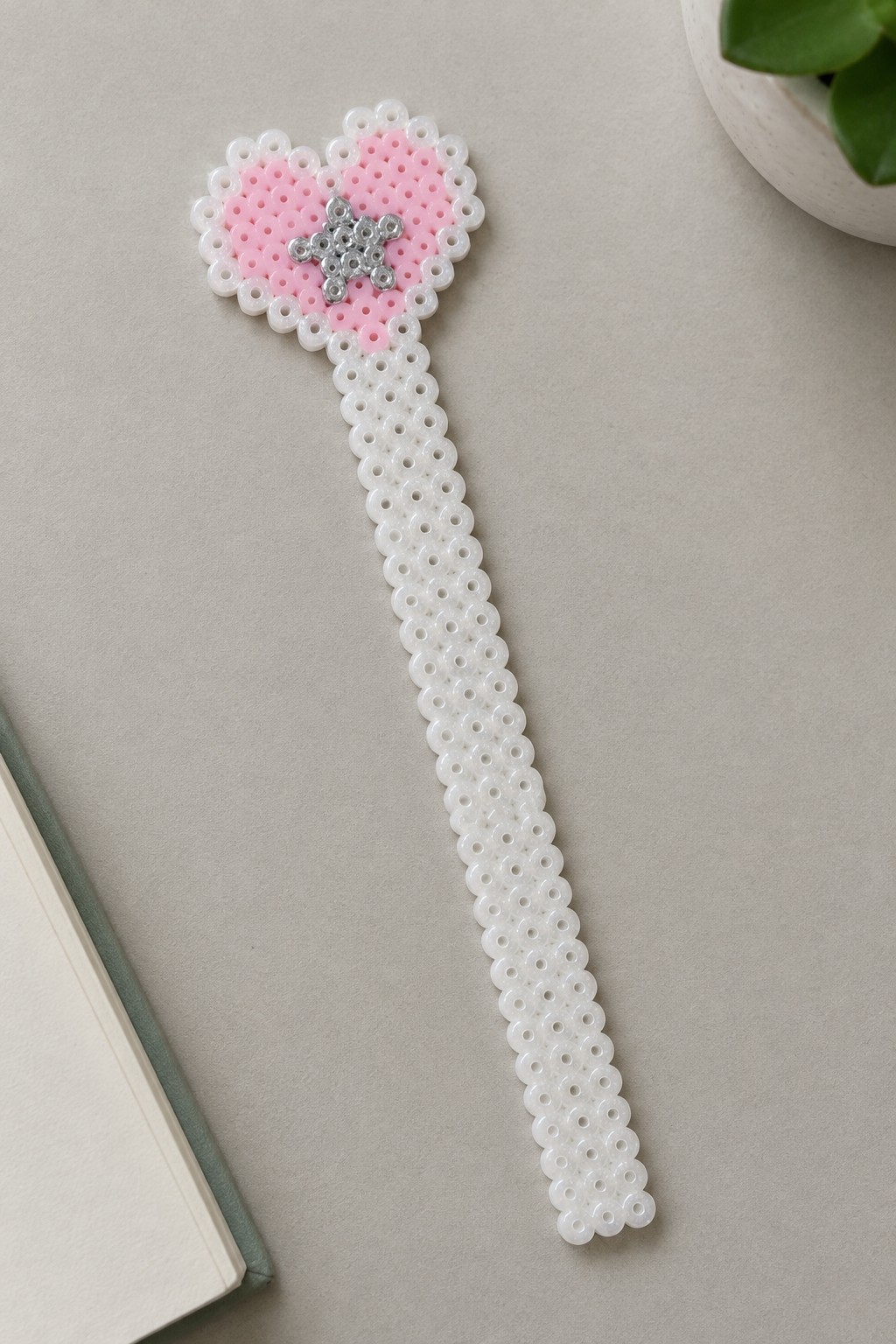 Pink perler bead heart with silver star on long white beaded handle