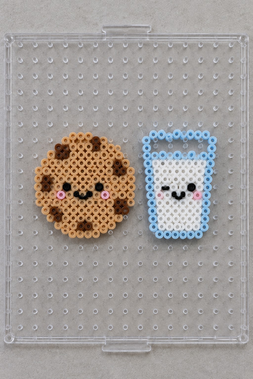 Perler bead cookie and milk with faces on clear pegboard