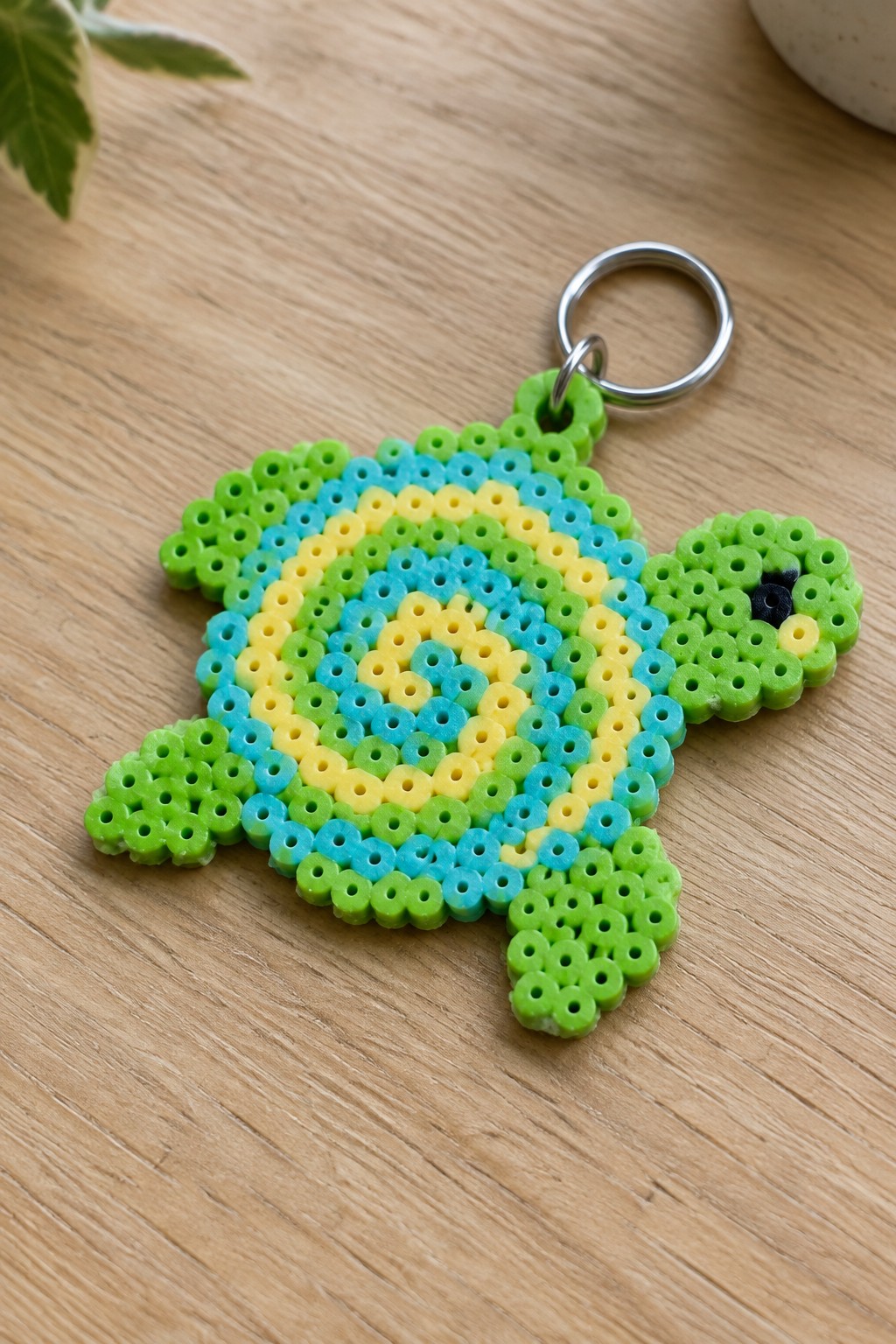 Colorful perler bead turtle keychain with green blue yellow shell and metal ring